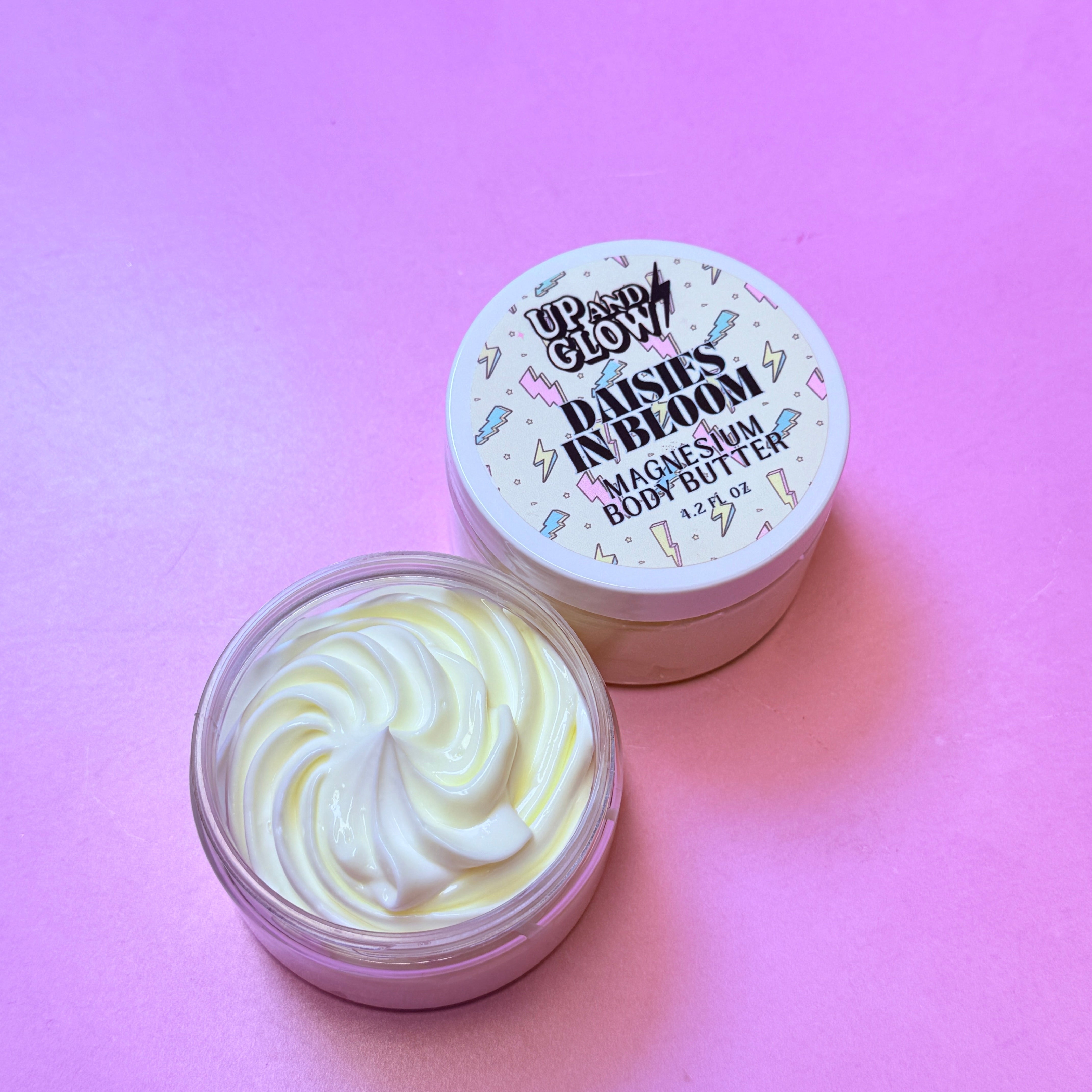 Jar of body butter with a decorative lid on a pink background. rice ceramides for repair 